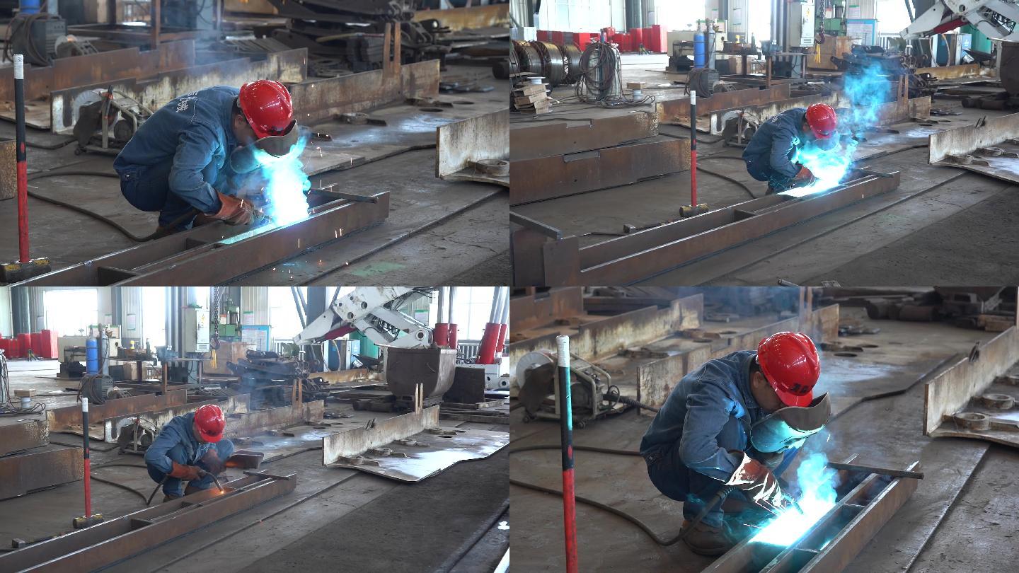 工人在車間電焊亞弧焊
